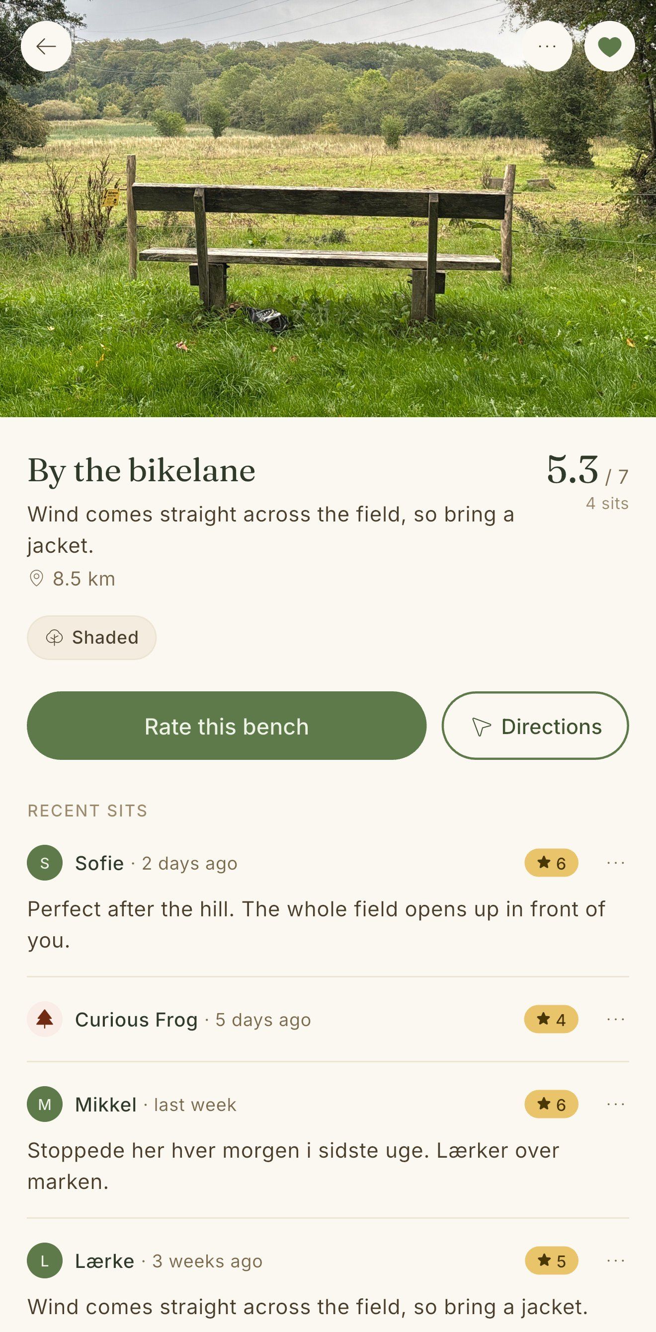 A bench page, a wooden bench facing an open field, rated 5.3 out of 7, above its most recent sits