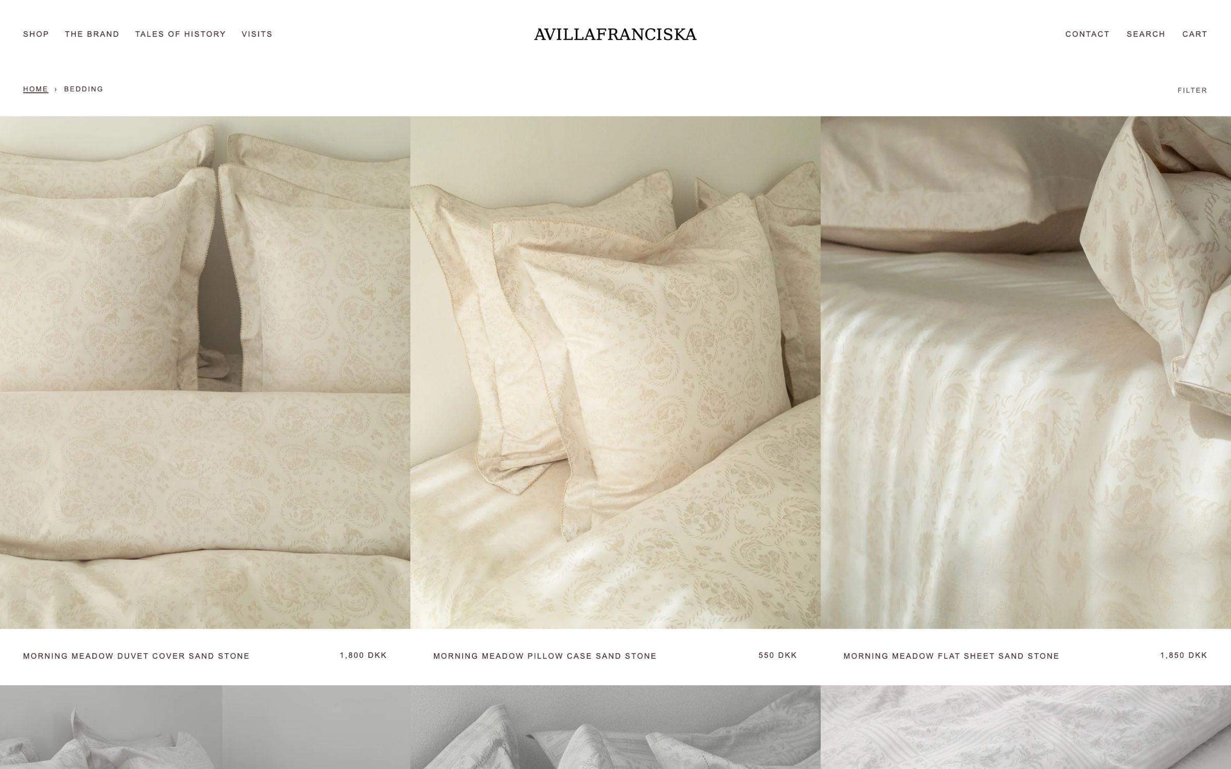 The bedding collection on desktop, a grid of cream jacquard duvet covers and pillowcases with names and prices